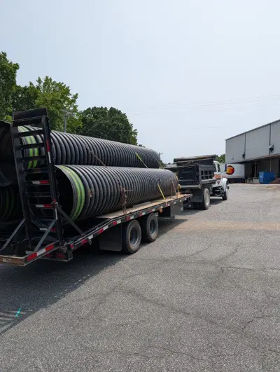 Large culvert drainage pipes ready for installation in Alamance County, NC